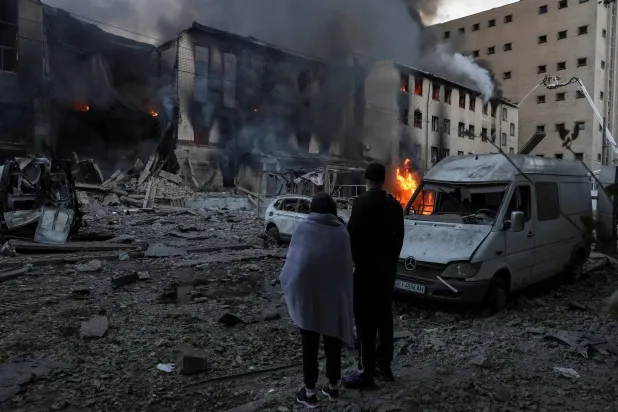 Residents stand at a site of a Russian missile attack, amid Russia's attack on Ukraine, in Kyiv, Ukraine September 8, 2026. (Reuters)