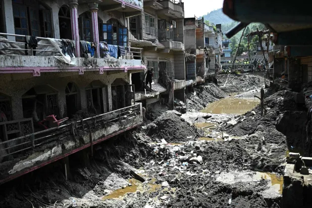 A man looks at the remains of sludge-ridden houses in the aftermath of flash floods at Devighat in Nepal's Nuwakot district on September 8, 2026. (AFP)