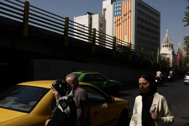 People walk near an anti-US mural in Tehran, Iran, September 2, 2026. Majid Asgaripour/WANA (West Asia News Agency) via Reuters