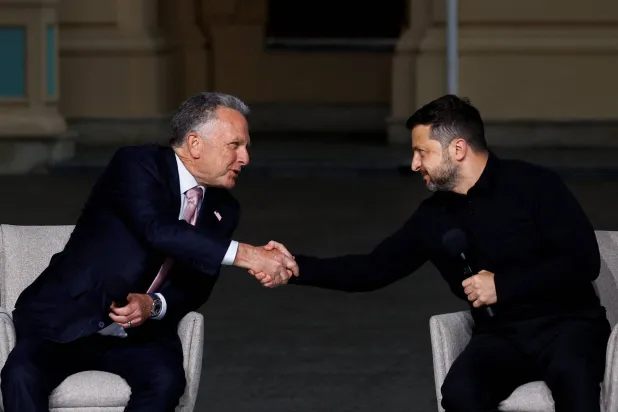 Ukraine's President Volodymyr Zelenskiy and US Special Envoy Steve Witkoff shake hands after a joint news conference with Jared Kushner, US President Donald Trump's son-in-law (not pictured), amid Russia's attack on Ukraine, in Kyiv, Ukraine September 6, 2026. (Reuters)