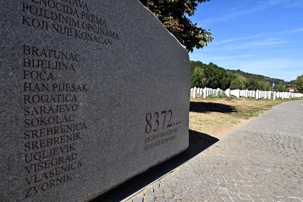 A photograph taken on September 7, 2026 shows a monument reading the figure "8372...", representing the minimum recorded number of victims of the July 1995 Srebrenica massacre at the Srebrenica-Potocari Genocide Memorial and Cemetery in Potocari, near Srebrenica, Bosnia and Herzegovina. (AFP)