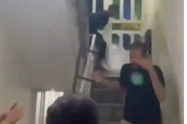 A still photo from a widely circulated video showing the attack on Iraqi students in Iran. 