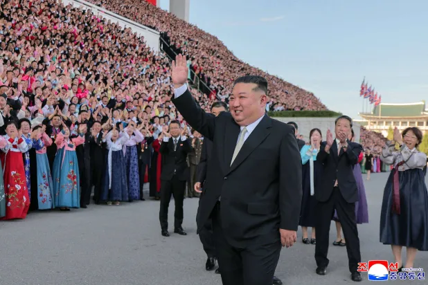 This picture taken on September 4, 2026 and released by North Korea's official Korean Central News Agency (KCNA) via KNS on September 5, 2026 shows North Korean leader Kim Jong Un waving during the 15th National Conference of Teachers in Pyongyang. (Photo by KCNA / KCNA VIA KNS / AFP) 