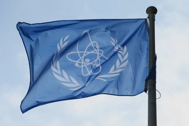 The International Atomic Energy Agency (IAEA) flag flies during a special session of an IAEA Board of Governors meeting in Vienna, Austria, March 2, 2026. (AP)