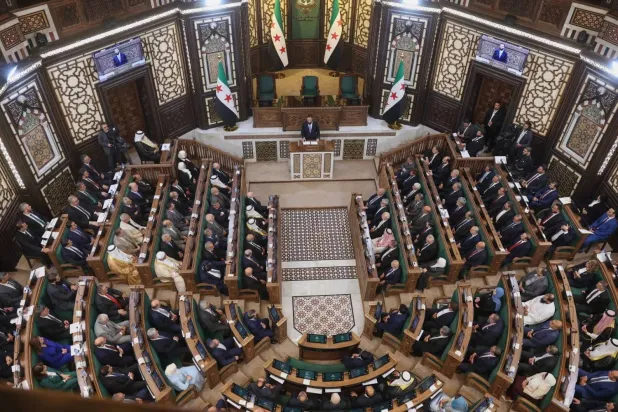 Syrian President Ahmad al-Sharaa addresses the Syrian People’s Assembly in Damascus, Syria, Sunday, July 12, 2026. AP