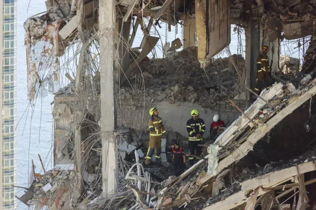 Ukrainian rescuers work amid the rubble at the site of a Russian strike on a multi-story residential building in Odesa, southern Ukraine, 12 September 2026, amid the ongoing Russian invasion. EPA/IGOR MASLOV