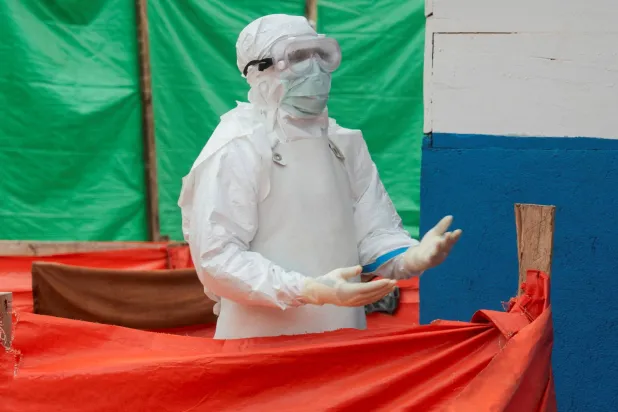A Congolese medical worker dressed in personal protective equipment (PPE) walks within the emergency unit at the Muthiri Adventist Hospital, as aid agencies intensify efforts to contain a new Ebola outbreak involving the Bundibugyo strain in the Mutiri quarter of Butembo, North Kivu province, Democratic Republic of Congo, September 10, 2026. (Reuters)