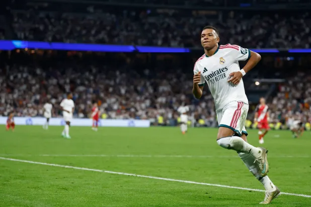 Real Madrid's French forward #10 Kylian Mbappe celebrates scoring his his team's fourth goal during the Spanish league football match between Real Madrid CF and Rayo Vallecano de Madrid at Santiago Bernabeu Stadium in Madrid on September 12, 2026. (AFP)