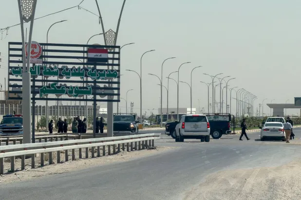 Security personnel stand near the Shalamsheh border crossing between Iraq and Iran, after Iraqi authorities ordered its closure as a precautionary measure following the latest drone attacks on Saudi Arabia, in Basra, Iraq, September 12, 2026. (Reuters) 