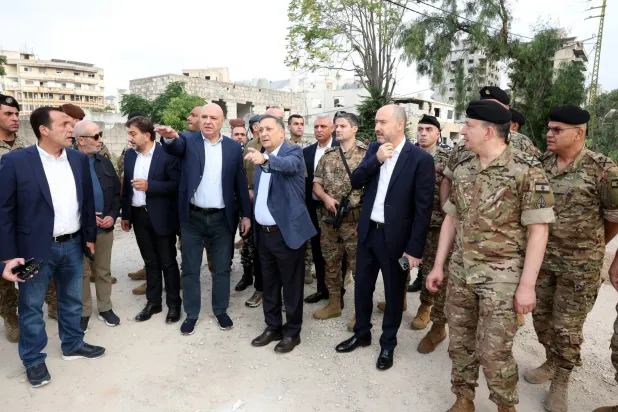 Lebanese President Joseph Aoun and an accompanying delegation tour the southern city of Nabatieh on Saturday (EPA)
