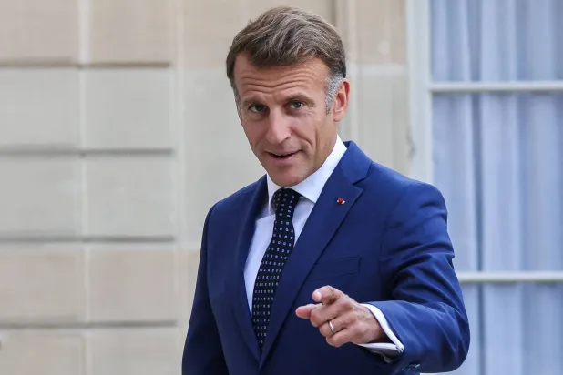  French President Emmanuel Macron gestures as he welcomes Vietnam's President and his wife at the Elysee Palace in Paris on September 10, 2026. (AFP) 