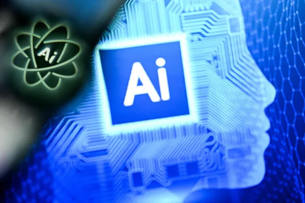 الحرفان «AI» (اختصاراً لمصطلح الذكاء الاصطناعي) على شاشة حاسوب محمول (أ.ف.ب)