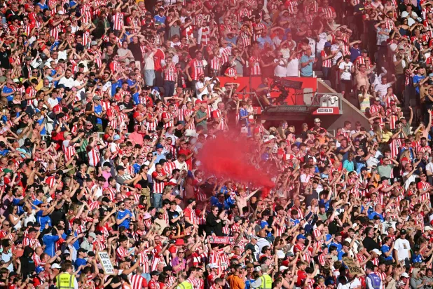 Sunderland fans celebrate after the English Premier League football match between Sunderland and Chelsea at the Stadium of Light in Sunderland in north-east England on May 24, 2026. (AFP)