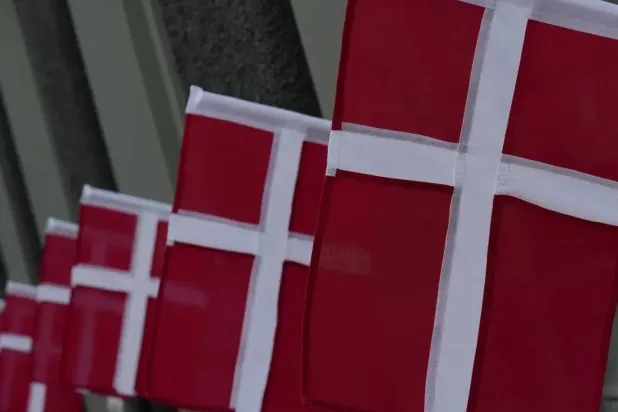 Danish flags flutter in a street in central Copenhagen, Denmark, July 24, 2025. (Reuters)