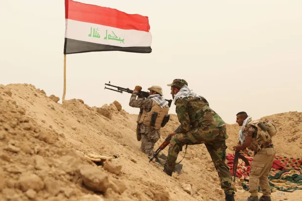 Fighters from the Badr Brigades clash with the ISIS group at the front line on the outskirts of Fallujah in the Anbar province of Iraq, June 1, 2015. (AP)