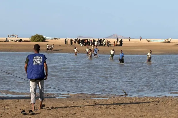 This handout picture taken and released by the International Organization for Migration (IOM) Djibouti shows refugees from Yemen fleeing fighting between government forces and Iran-backed Houthi militants as they arrive at a Djibouti Coast Guard post in Khor Angar on September 13, 2026. (Handout / IOM Djibouti / AFP) 