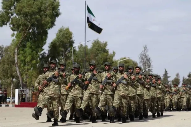 A military parade during a graduation ceremony for personnel of the Syrian army’s 56th Division on June 1, 2025. (Defense Ministry)