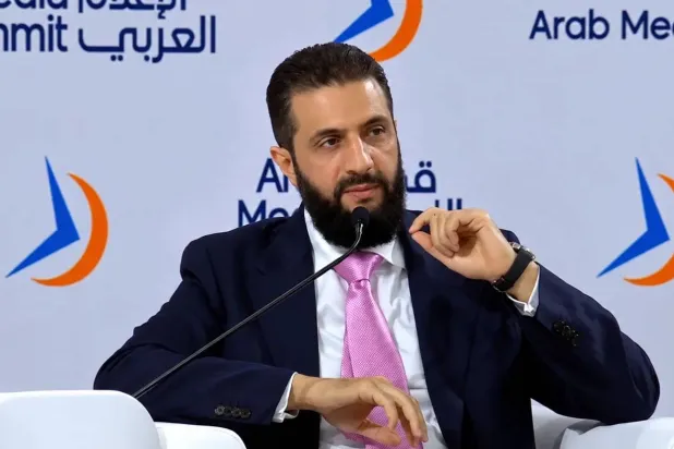 Syrian President Ahmad al-Sharaa speaks at the Arab Media Summit in Dubai on Tuesday. (Asharq Al-Awsat)