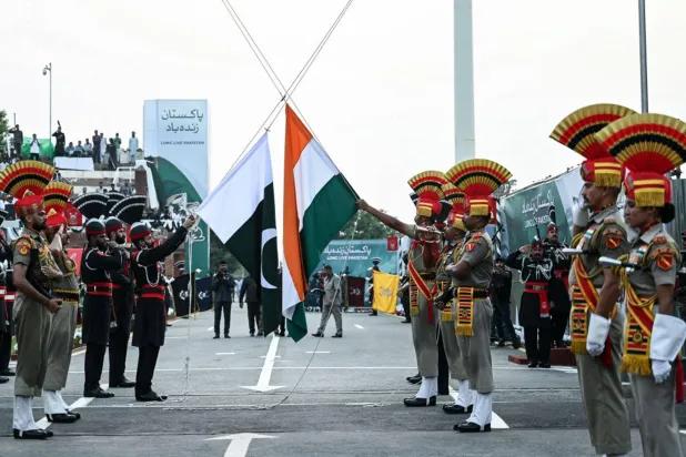 Indian Border Security Force personnel and Pakistani Rangers take part in a ceremony on the occasion of Pakistan's Independence Day and eve of India's Independence Day at the India-Pakistan Wagah border post on August 14, 2024. (AFP via Getty Images)