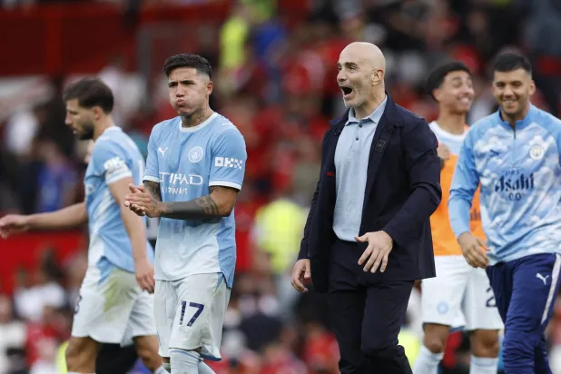 Football - Premier League - Manchester United v Manchester City - Old Trafford, Manchester, Britain - September 13, 2026 Manchester City manager Enzo Maresca celebrates with Enzo Fernandez after the match. (Reuters)