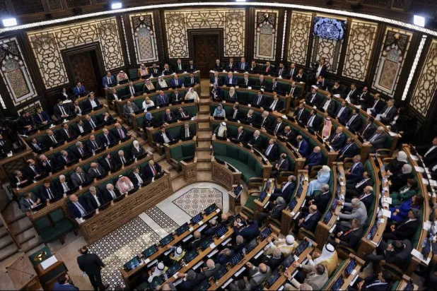 Members of Syria's newly formed People's Assembly attend the body's inaugural session, the first parliament session since the end of the rule of ousted Syrian President Bashar al-Assad, in Damascus, Syria, July 12, 2026. (Reuters)