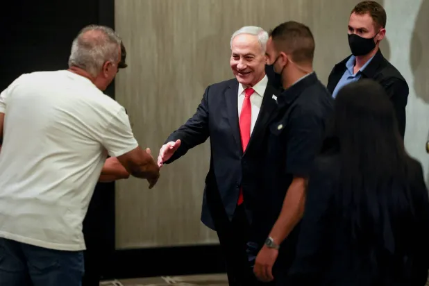 Israeli Prime Minister Benjamin Netanyahu greets supporters after delivering a statement to members of the press, in Jerusalem, September 8, 2026. (Reuters) 