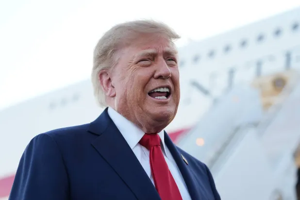 President Donald Trump speaks to reporters at Charlotte Douglas International Airport, Wednesday, Sept. 16, 2026, in Charlotte, N.C. (AP Photo/Alex Brandon)