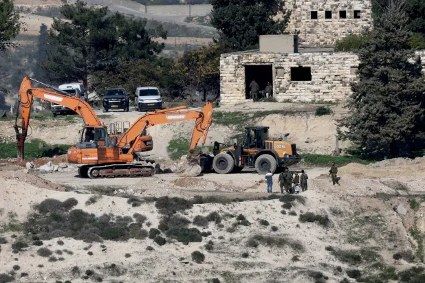 Israeli bulldozers level land at the evacuated Israeli settlement of Sanur, near the West Bank city of Jenin, 23 December 2025. EPA/ALAA BADARNEH