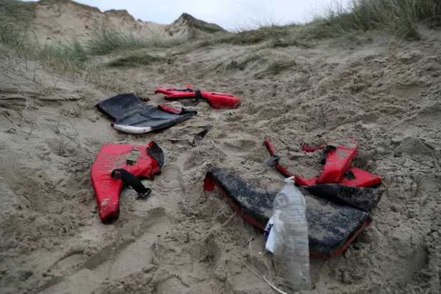 FILE PHOTO: Life jackets abandoned by migrants are seen in the Slack dunes, the day after migrants died when their dinghy deflated as they attempted to cross the English Channel, in Wimereux, near Calais, France, November 25, 2021. REUTERS/Pascal Rossignol/File Photo