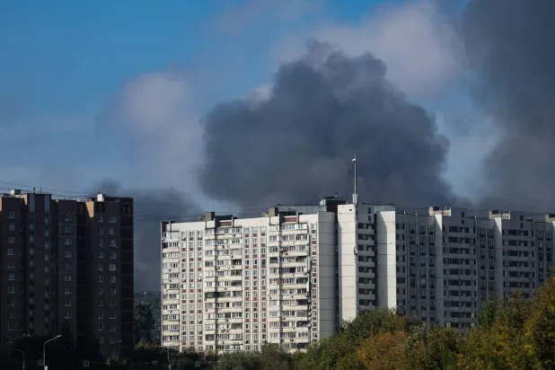Smoke rises behind a multi-story building following a reported Ukrainian drone attack in Dzerzhinsky, Moscow region, Russia, 20 September 2026. EPA/STRINGER