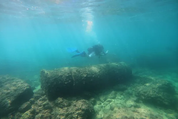 A diver passes above Roman-era columns at an archaeological site near the coast in the southern port city of Tyre, Lebanon, Thursday, Sept. 17, 2026. (AP Photo/Bilal Hussein)
