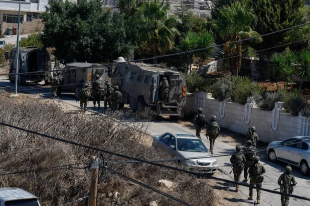 Israeli forces take part in a raid in the Palestinian town of Biddu, in the Israeli-occupied West Bank, September 21, 2026. REUTERS/Mohammed Torokman
