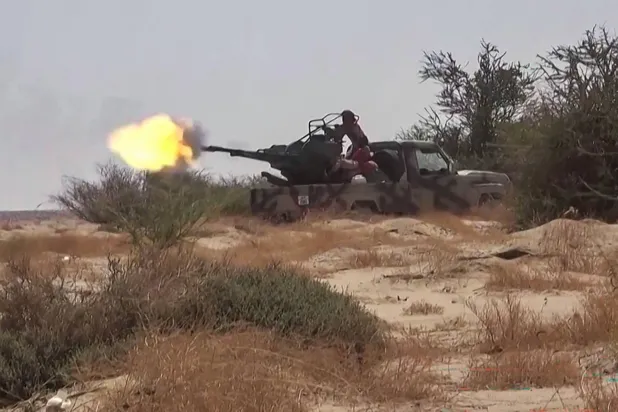 This frame grab taken from AFPTV video footage shows fighters affiliated with the Yemeni government engaging in clashes with Houthi militants in Al-Jawf province on September 15, 2026. (AFPTV / AFP) 