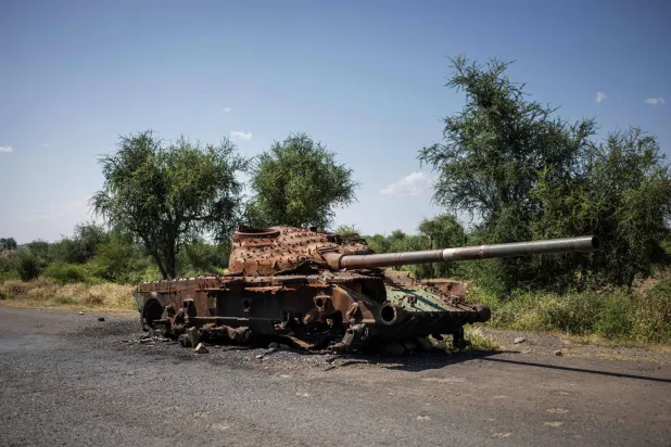 (FILES) The charred remaining of a T-72 tank lay on the road that connects Shiraro to Shire on October 12, 2024.  (Photo by Michele Spatari / AFP)