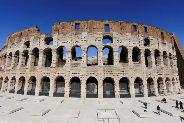 FILE PHOTO: People walk across restored southern ambulatory areas of the Colosseum, in Rome, Italy, March 17, 2026. REUTERS/Yara Nardi/File Photo