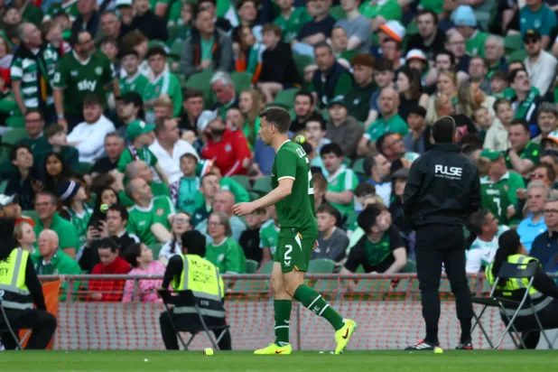 Ireland's Seamus Coleman walks as tennis balls are thrown on to the pitch during the international friendly soccer match between Ireland and Qatar in Dublin, Ireland, Thursday, May 28, 2026. (AP Photo/Peter Morrison) License this photo