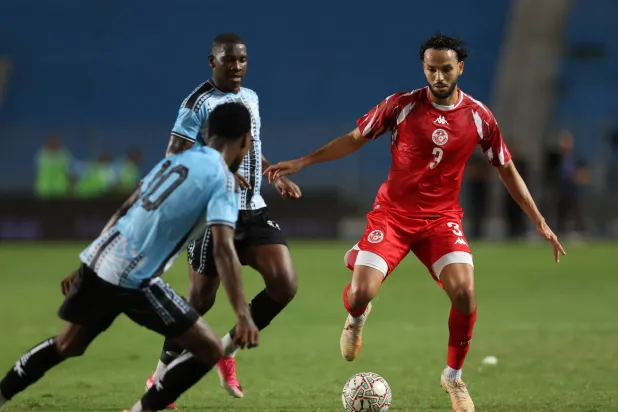 Tunisia's Montassar Talibi (R) fights for the ball with player of Botswana's Thero Setsile (L) during the CAF Africa Cup of Nations 2027 qualifying Group H match between Tunisia and Botswana in Tunis, Tunisia, 28 September 2026. (EPA) 