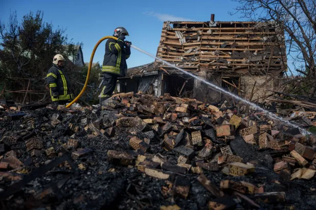  Rescue workers put out a fire at a residential house destroyed in a Russian missile strike on Vyshhorod, Kyiv region, Ukraine, Wednesday, Sept. 30, 2026. (AP) 