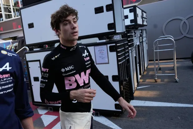 Alpine driver Franco Colapinto of Argentina walks down pit lane following his crash during the Azerbaijan F1 Grand Prix auto race, in Baku, Azerbaijan, Saturday, Sept. 26, 2026. (AP Photo/Darko Bandic) 
