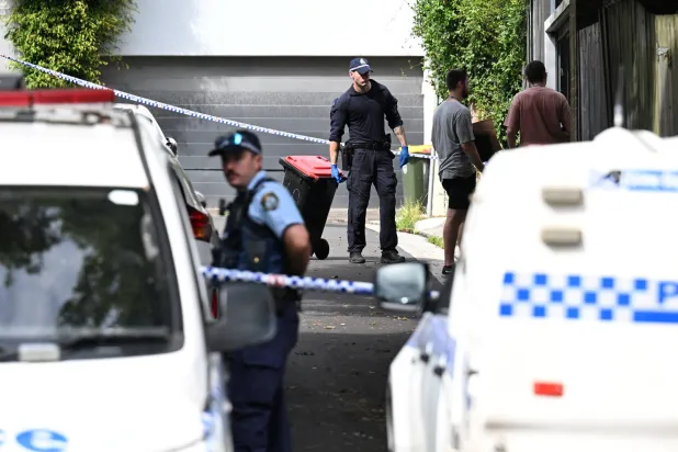 Police officers work at a crime scene at Waite Road in Paddington, Sydney, Australia February 23, 2024. AAP Image/Dean Lewins via REUTERS