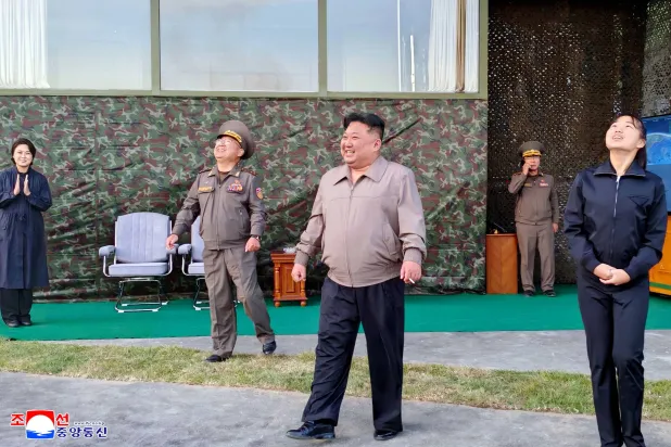 North Korean leader Kim Jong Un, accompanied by his daughter Kim Ju Ae, attends to oversee the firing of an intermediate-range missile from the eastern region of the country toward the East Sea during a drill in North Korea, October 3, 2026, in this picture released by North Korea's official Korean Central News Agency. (KCNA via Reuters)