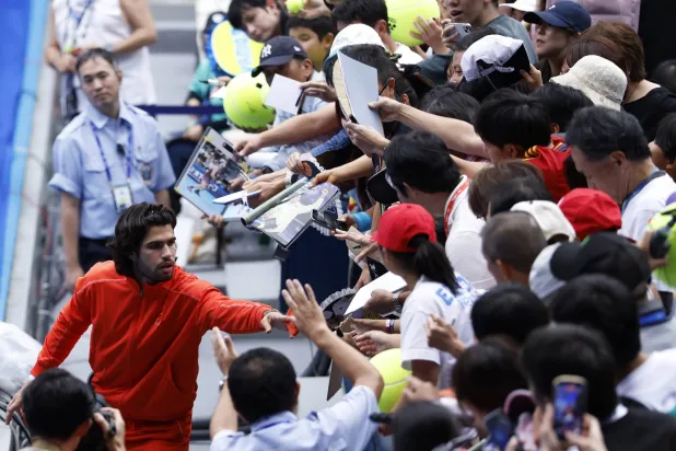 Carlos Alcaraz of Spain gives his wristband to a fan after his quarterfinal match against Denis Shapovalov of Canada during the Japan Open tennis tournament at Ariake Colosseum in Tokyo, Japan, 04 October 2026. EPA/KIYOSHI OTA