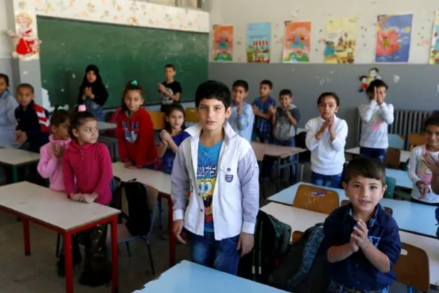 Syrian refugee children attend a class at a school in Mount Lebanon, October 7, 2016. REUTERS/Mohamed Azaki