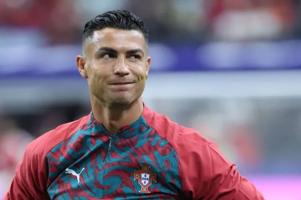 Portugal's forward #07 Cristiano Ronaldo warms up ahead of the 2026 World Cup round of 16 football match between Portugal and Spain at the Dallas Stadium in Arlington on July 6, 2026. (AFP)