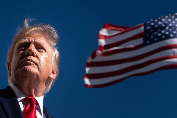  President Donald Trump speaks with reporters before boarding Marine One on the South Lawn of the White House, Wednesday, Oct. 7, 2026, in Washington. (AP) 