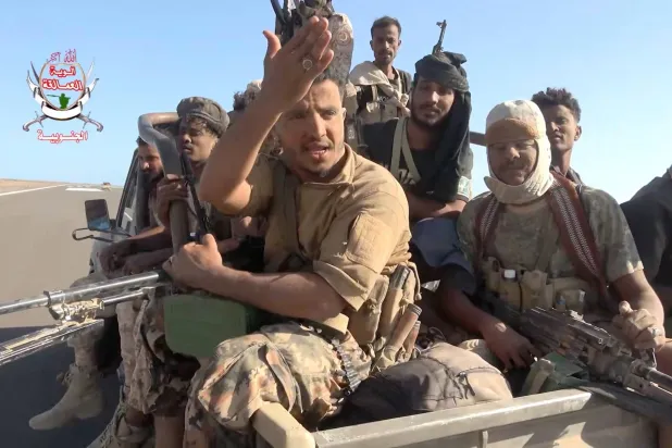 Yemeni government fighters sit in the back of a vehicle near Dhubab, Taiz Governorate, Yemen, in this still image taken from video released October 5, 2026.    Southern Giants Brigades/Handout via REUTERS