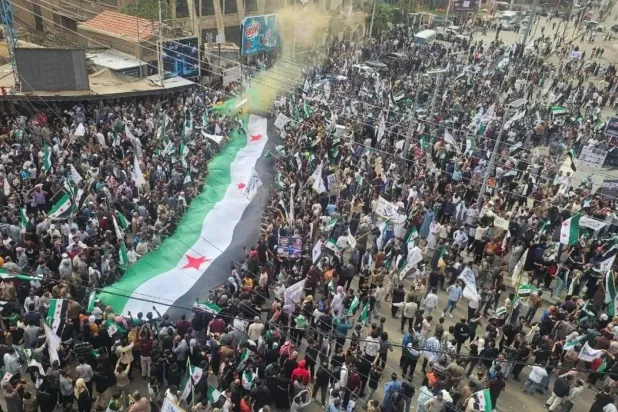 The Syrian flag at a protest in Hasakah (Social media)