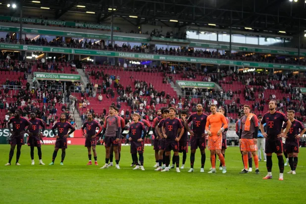 Bayern players react after the German Bundesliga soccer match between FC Augsburg and FC Bayern Munich in Augsburg, Germany, Oct. 10, 2026. (AP Photo/Matthias Schrader)