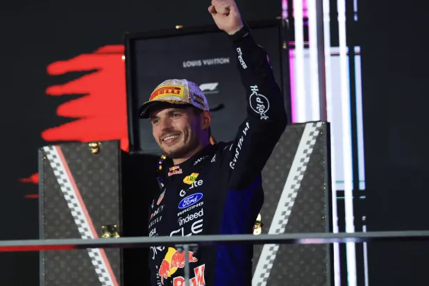Race winner Red Bull Racing driver Max Verstappen of Netherlands celebrates on the podium during the 2026 Formula 1 Singapore Grand Prix at the Marina Bay Street Circuit in Singapore, 11 October 2026.  EPA/FAZRY ISMAIL