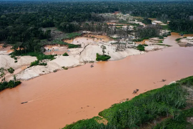 Deforestation from illegal mining borders the Malinowski River in the Tambopata National Reserve in Puerto Maldonado, Peru, Tuesday, Aug. 11, 2026. (AP Photo/Guadalupe Pardo)